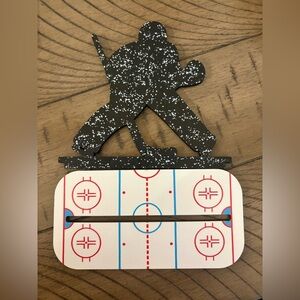 Hockey Player Silhouette with Rink Design
